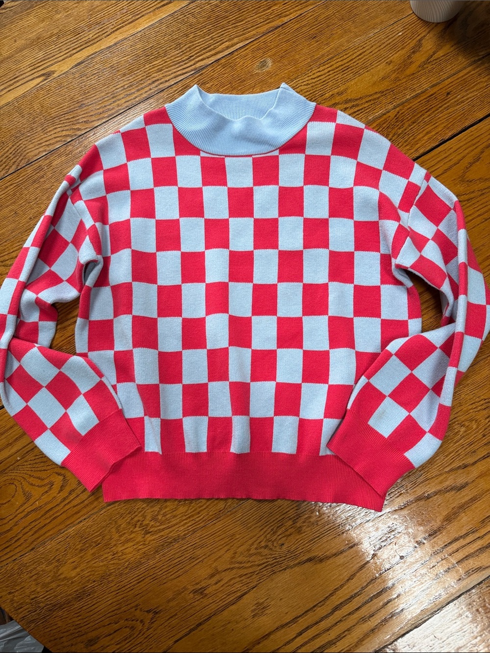 THML pink and blue checker board pattern pullover sweater. Size Large.